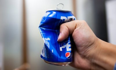 crushing of can of soda