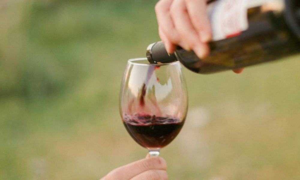 pouring wine on glass