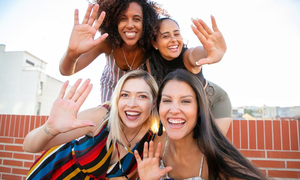 ladies waving hands