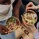 man and woman eating healthy foods